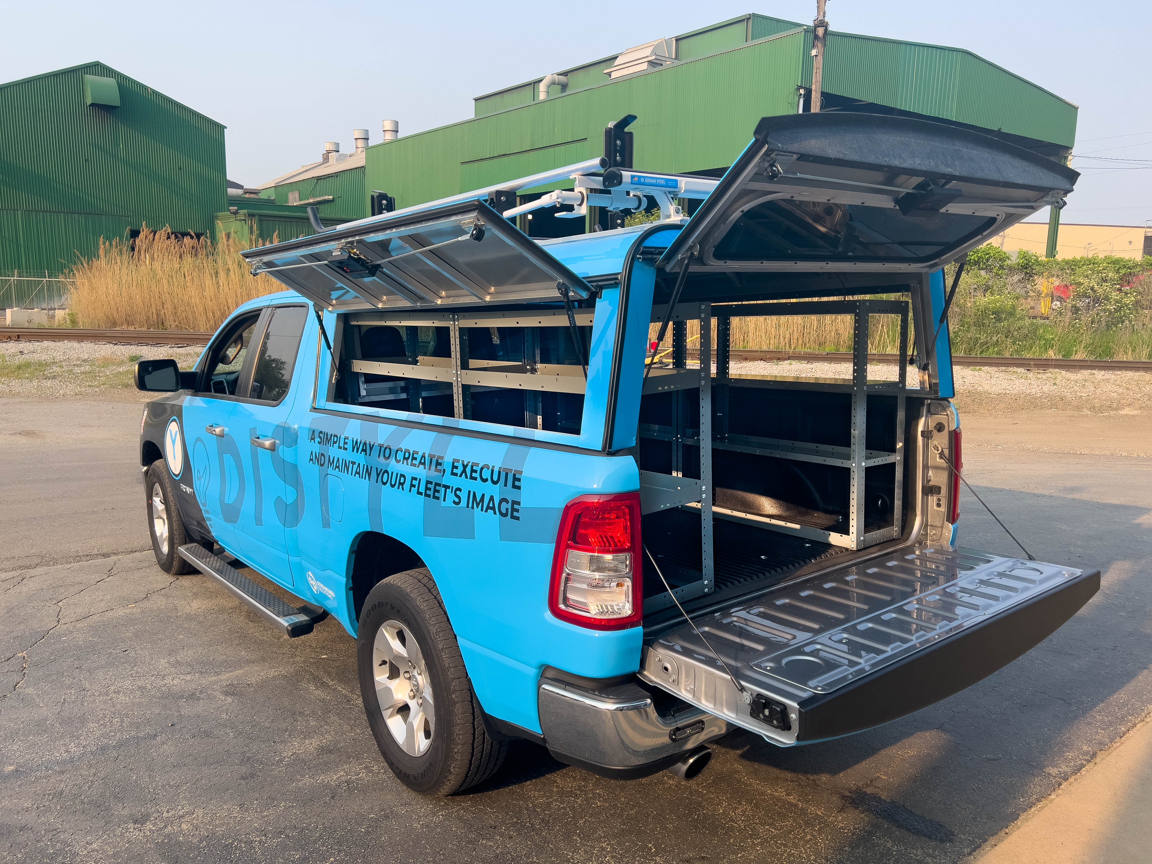 exterior view of the left side of a pickup fully upfitted with an Adrian Steel Base truck storage package
