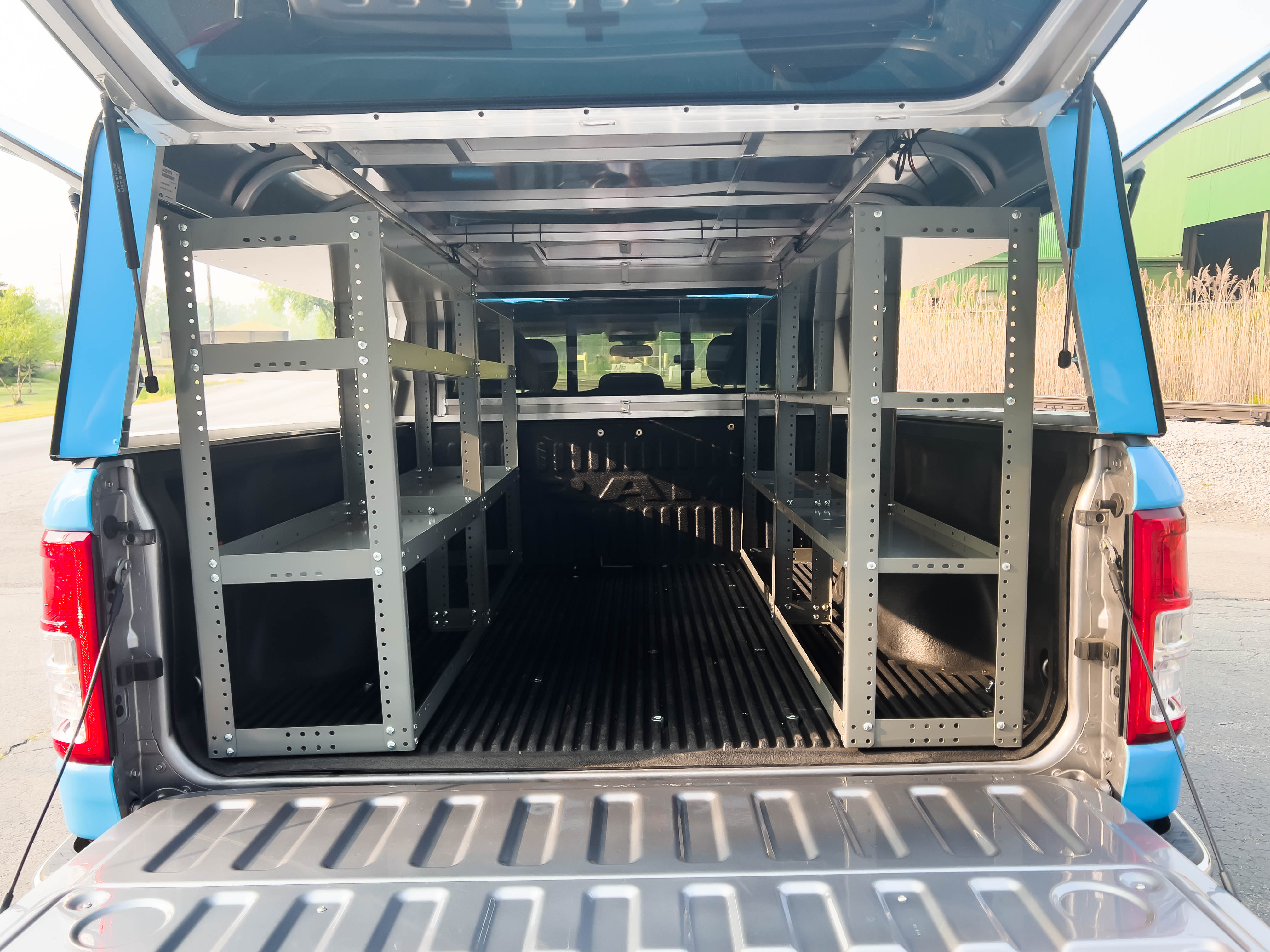 rear view of a pickup upfitted with an Adrian Steel Base truck storage package