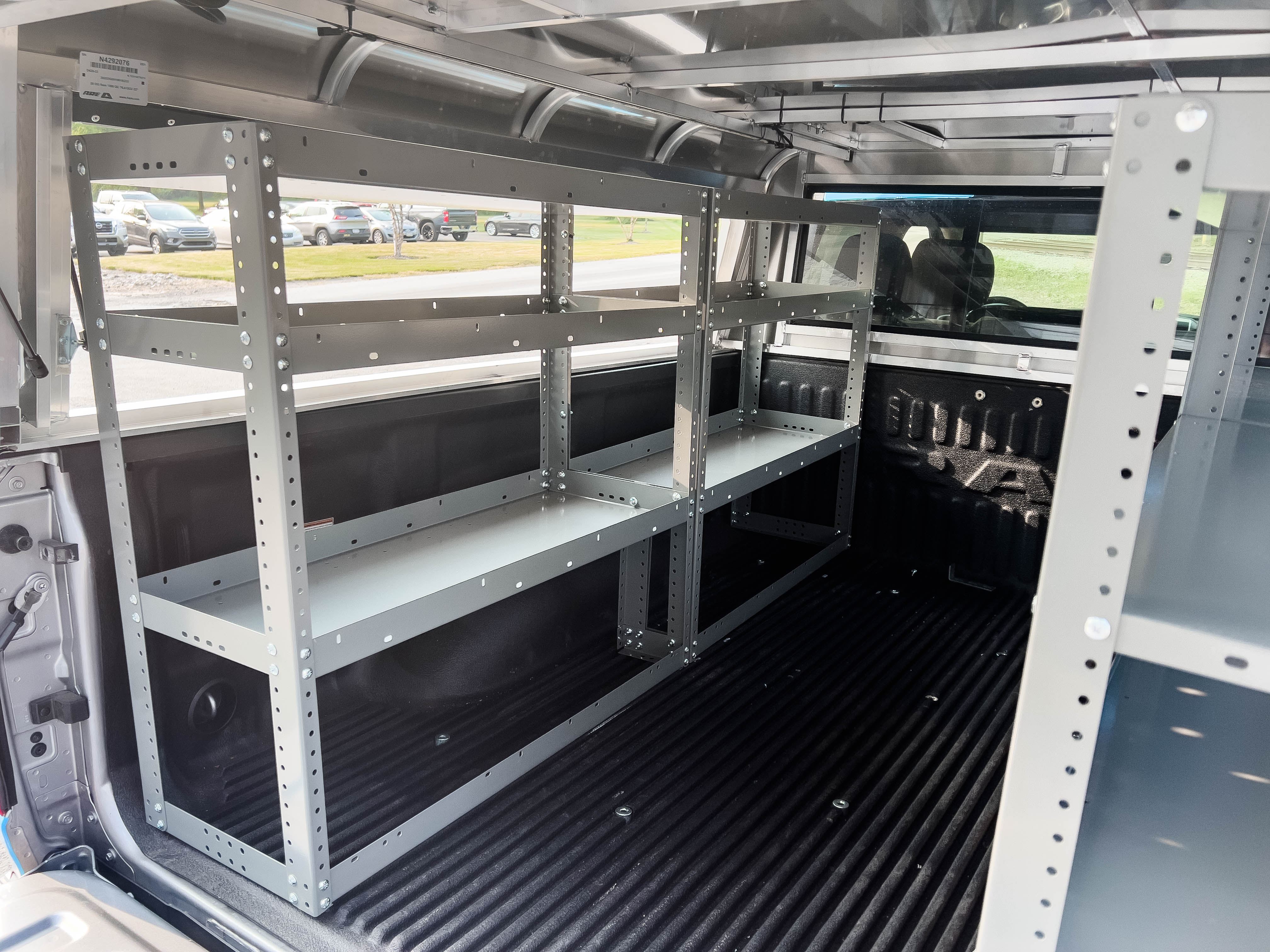 two empty shelves in a pickup upfitted with an Adrian Steel Base truck storage package