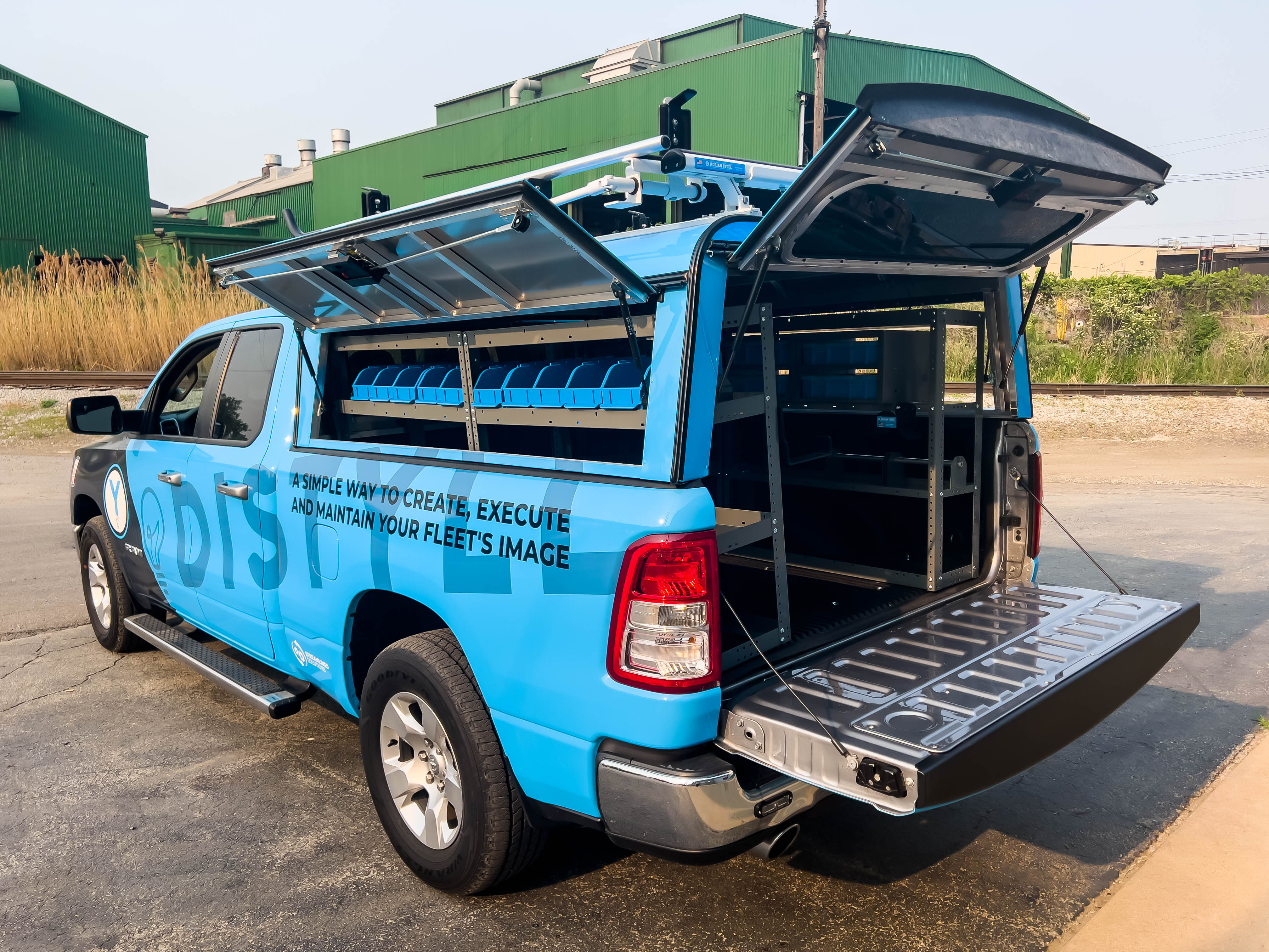 exterior view of the left side of a pickup fully upfitted with an Adrian Steel Electrician truck storage package