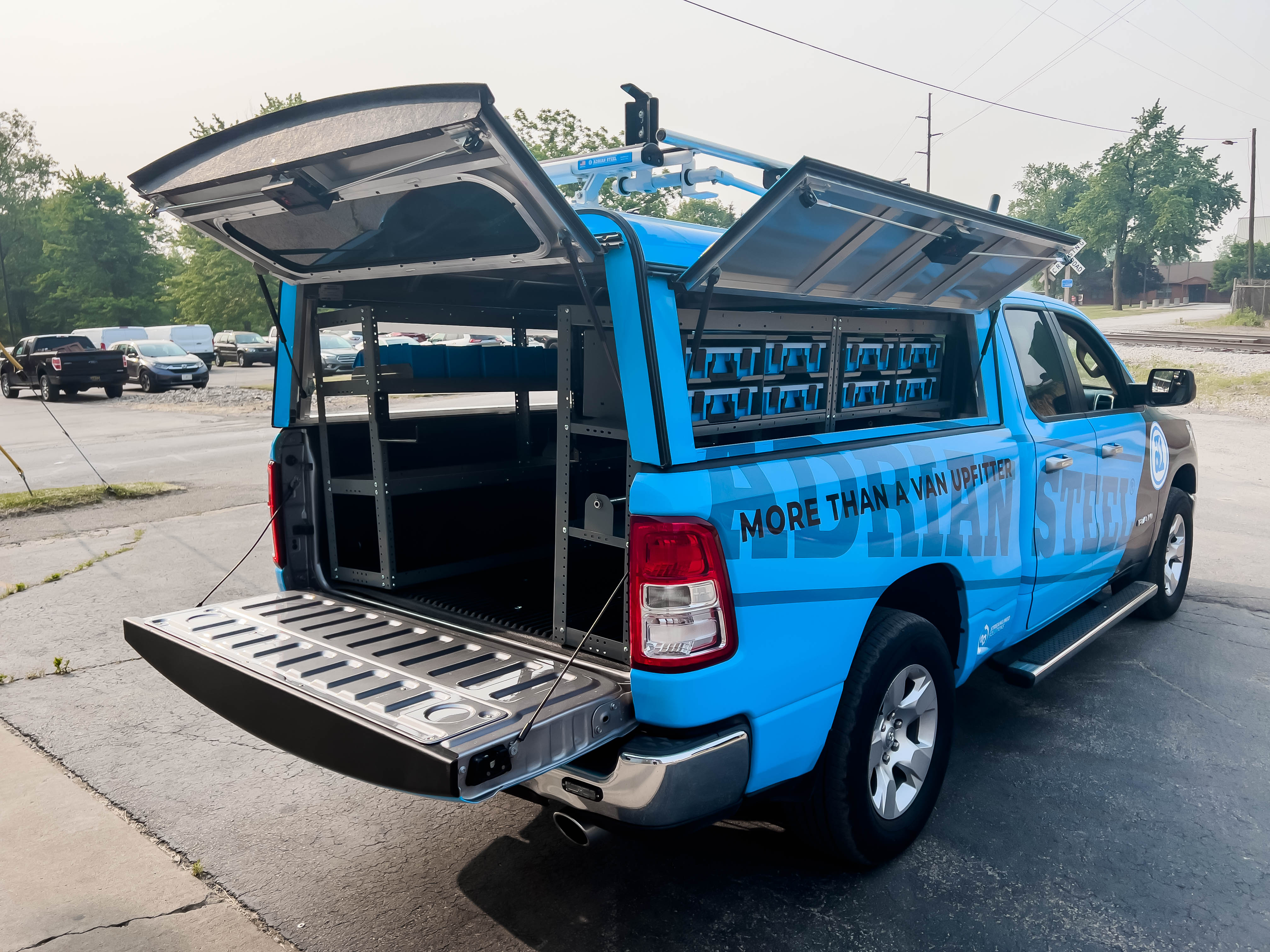 exterior view of the right side of a pickup fully upfitted with an Adrian Steel Electrician truck storage package