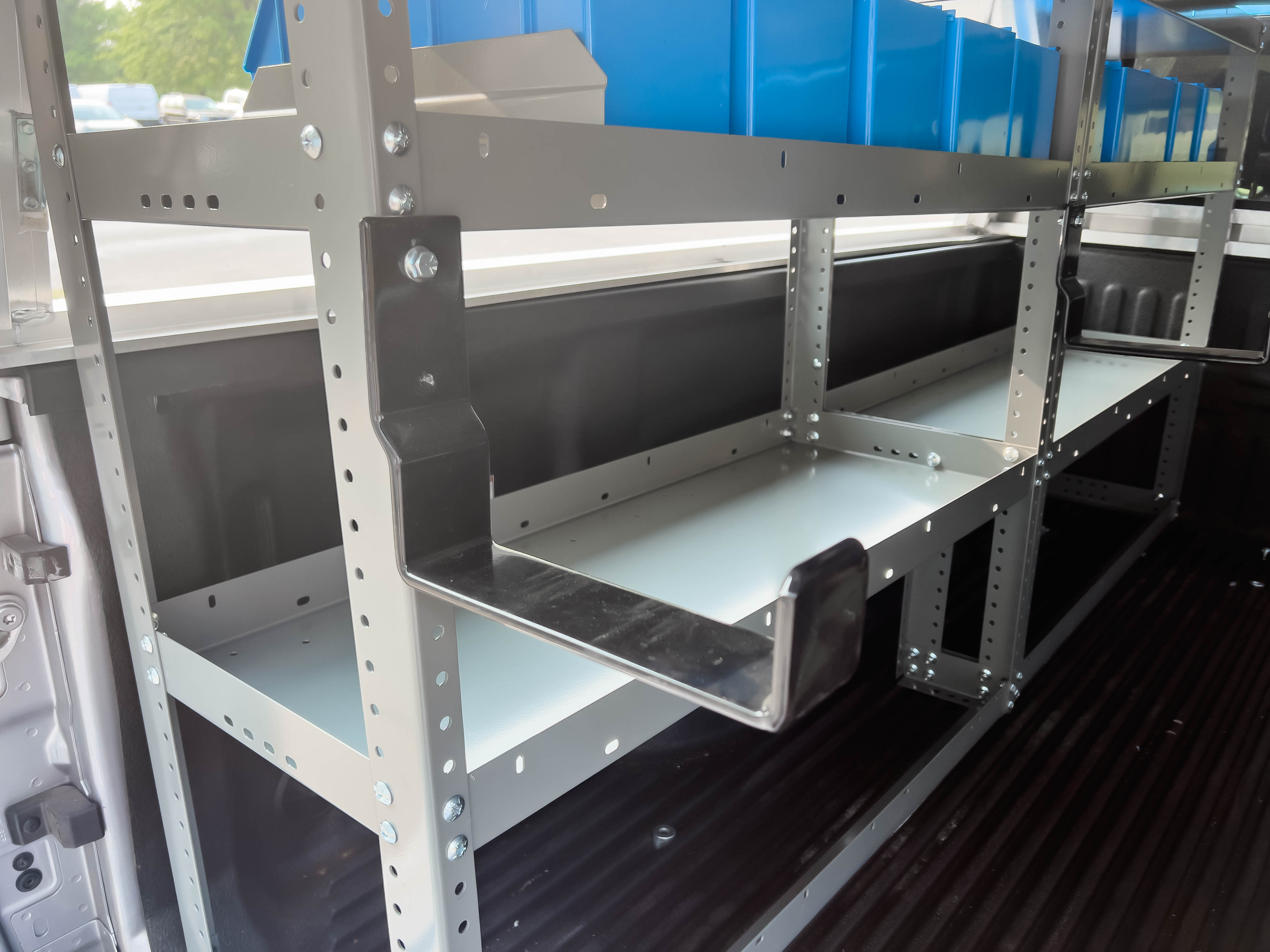 two hooks mounted on a shelf in a pickup upfitted with an Adrian Steel Electrician truck storage package