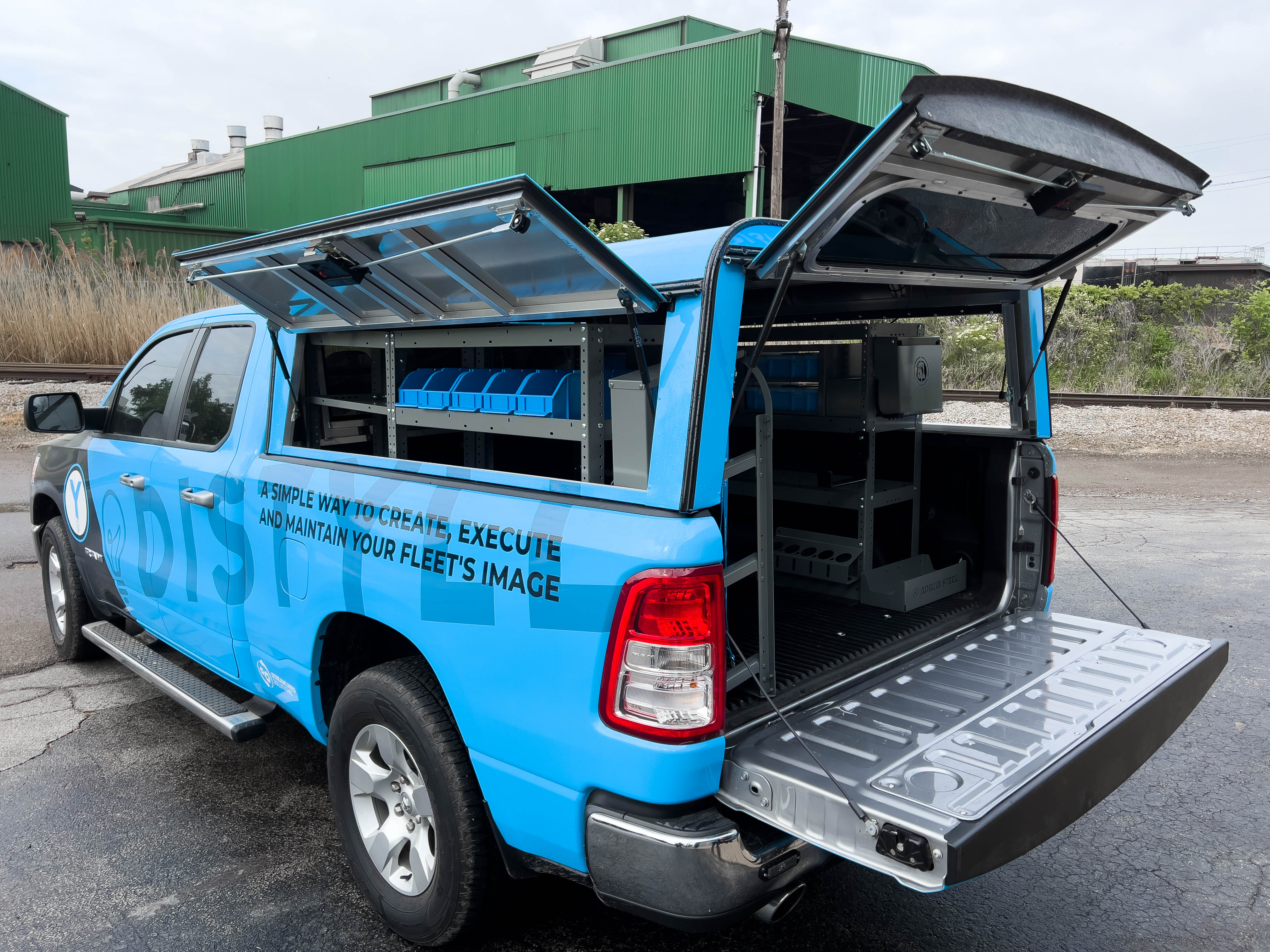 exterior view of the left side of a pickup fully upfitted with an Adrian Steel HVAC/Mechanical truck storage package