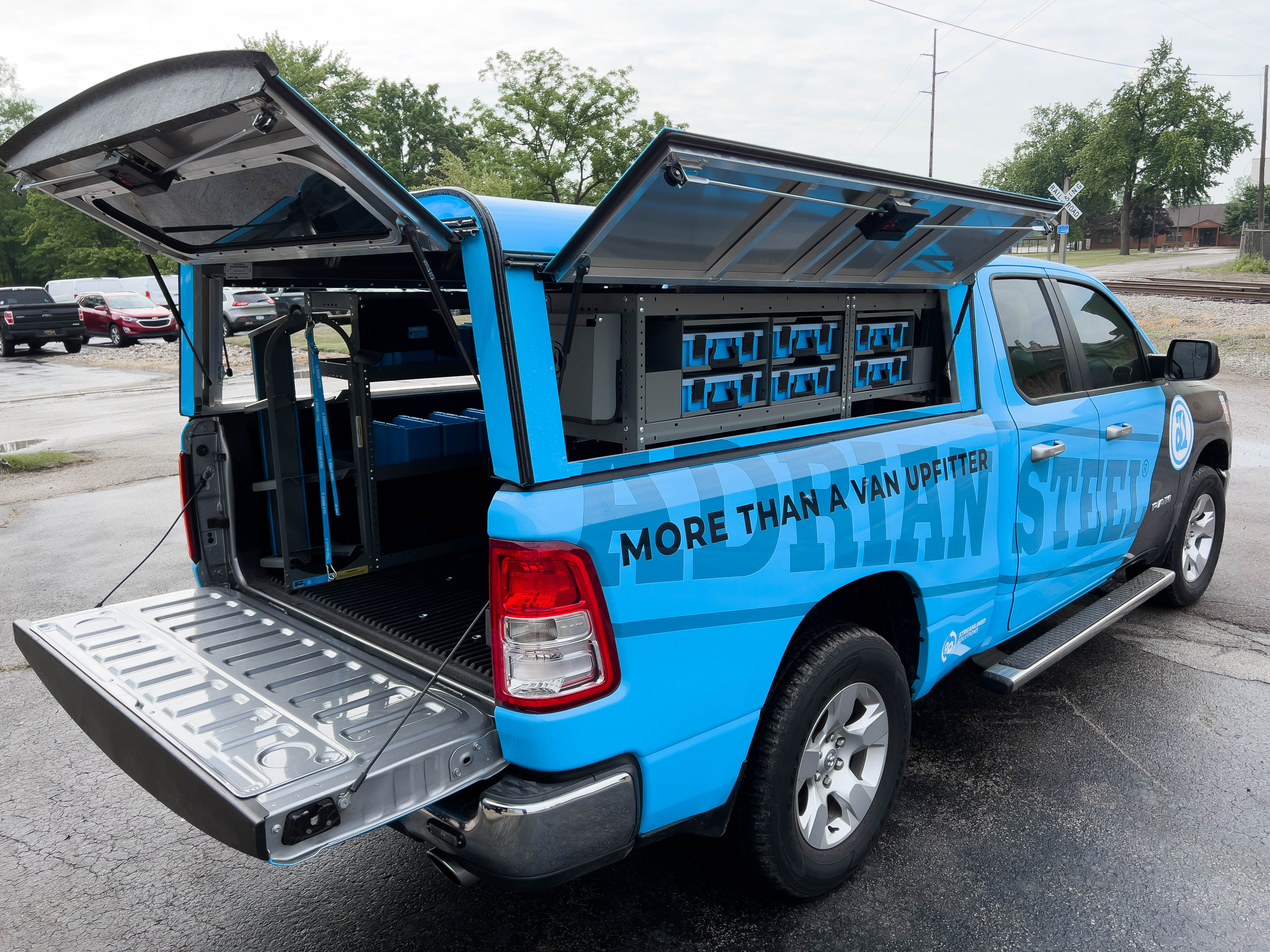 exterior view of the right side of a pickup fully upfitted with an Adrian Steel HVAC/Mechanical truck storage package