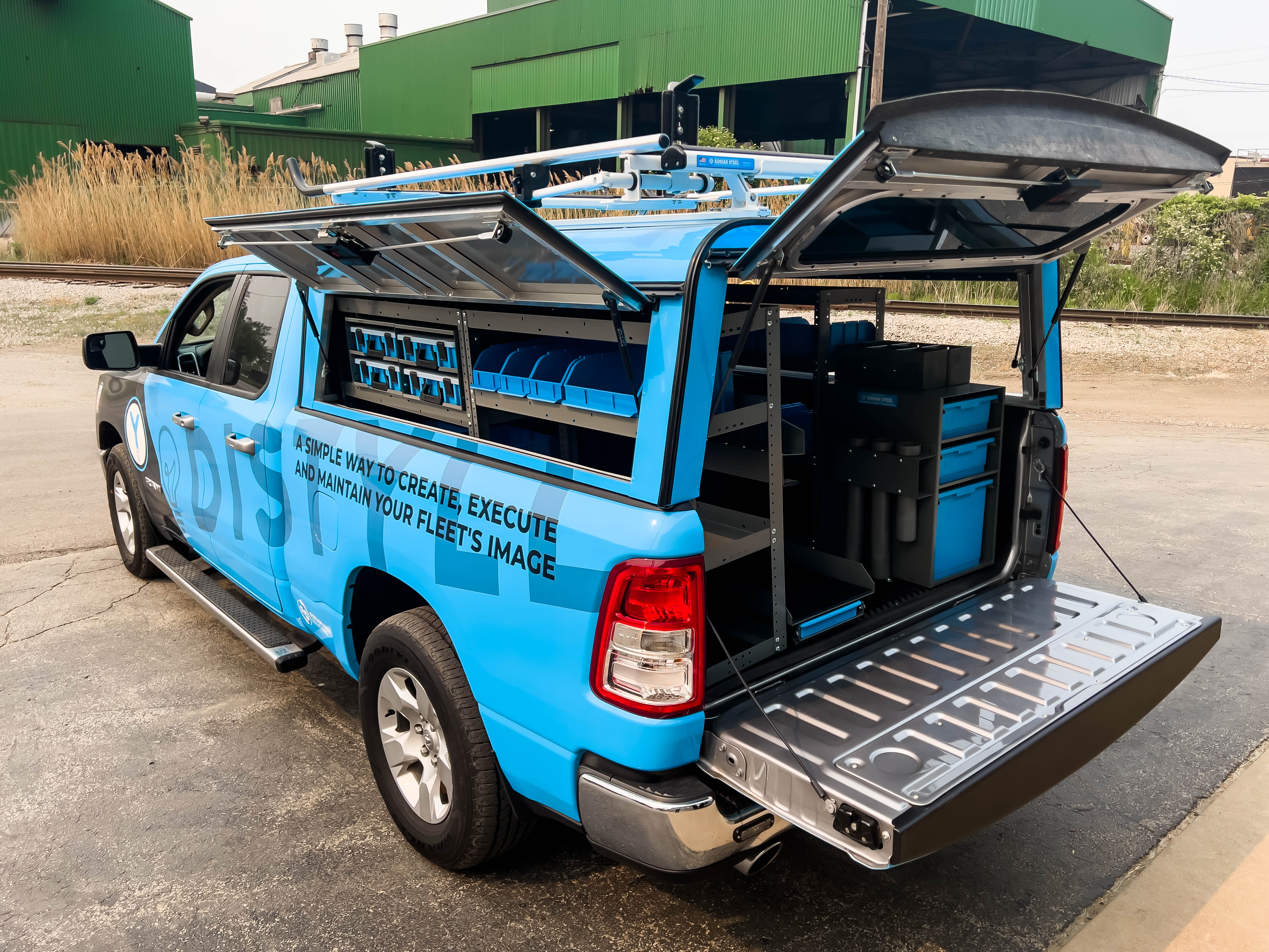 exterior view of the left side of a pickup fully upfitted with an Adrian Steel Security Contractor truck storage package