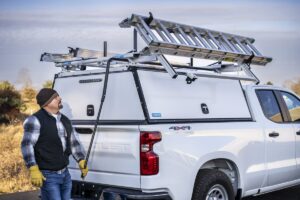 A man looking at the best truck ladder rack by Adrian Steel on his truck