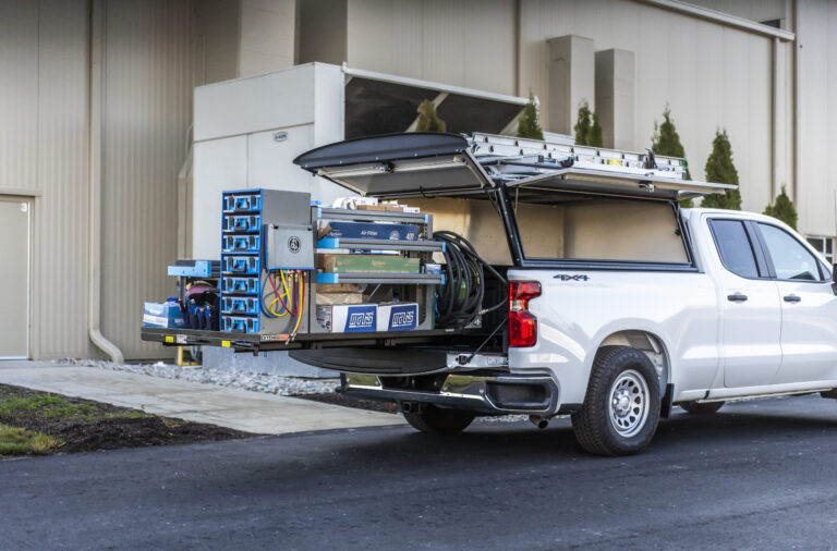 Truck showing a pulled out Adrian Steel truck upfit.