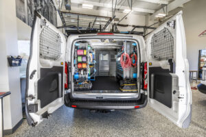 back of a van opened up to showcase various mobile office accessories