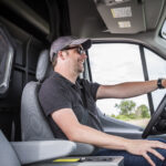 photo of smiling man driving an Adrian Steel partition