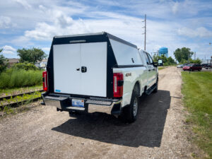 Work truck with a barn door truck topper
