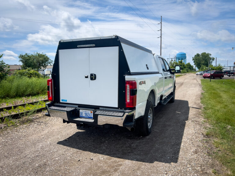 Work truck with a barn door truck topper