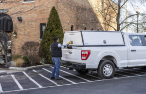 Worker opening the truck slideout sytem.