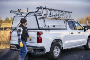 Work truck upfitted with Adrian ladder racks and ladders.