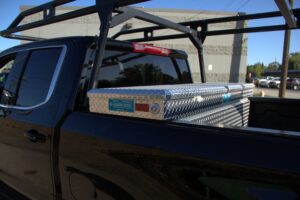 Truck with a tool box and ladder rack