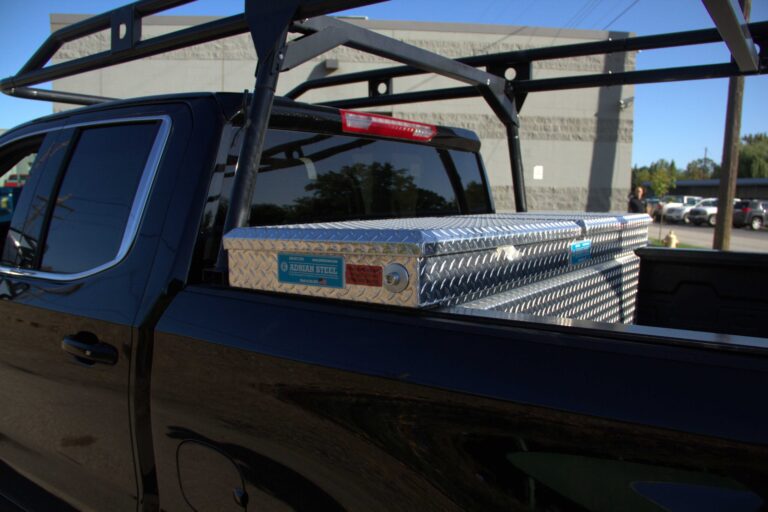 Truck with a tool box and ladder rack